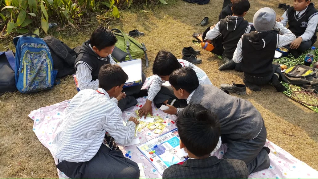 Children taking part in a creative outdoor school activity