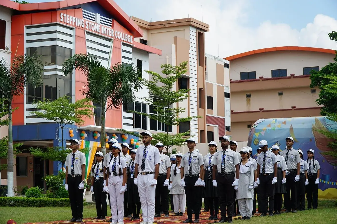 Students in formation on the Green City lawn